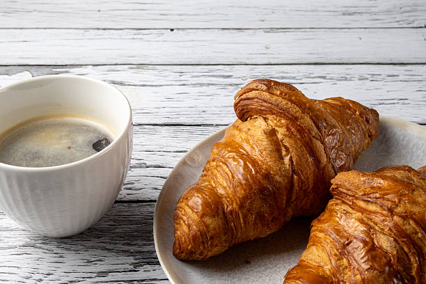 istock Croissant and Coffee on White Background 2247596587
