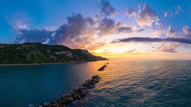istock Coastal Sunset with Vibrant Clouds 2247596627