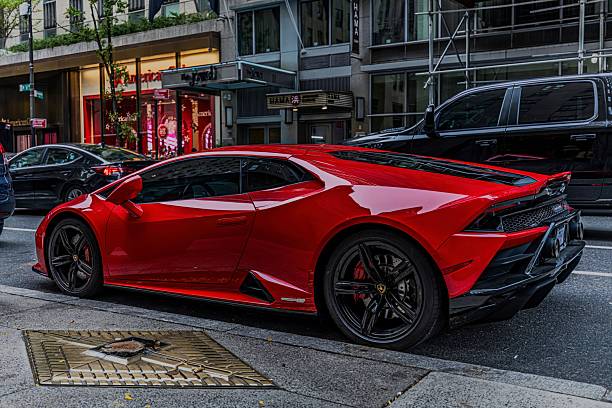 New York, United States – November 15, 2025: A sleek red Lamborghini parked on a city side street