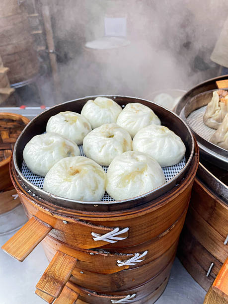 istock Steaming Hot Freshly Steamed Buns in a Breakfast Shop 2247600997