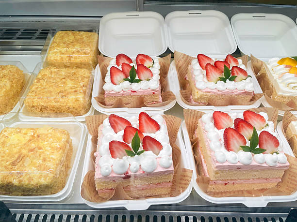 istock Cream Cakes with Sliced Strawberries in Bakery Display Window 2247601030