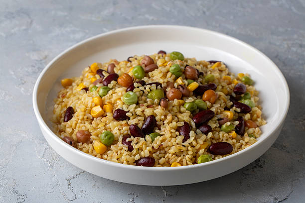 istock Bulgur pilaf with legumes; with peas, beans and corn kernels. 2247602760