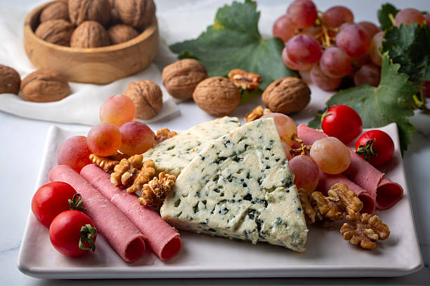 istock Sliced blue cheese - Roquefort cheese or gorgonzola cheese 2247604606