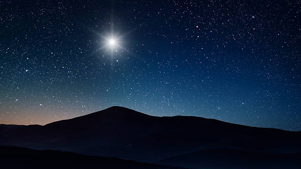 istock night Christmas panorama with a star in the sky 2247605695