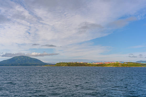istock Calm waters and distant mountains create a serene view of the shimmering coastline at midday 2247607840