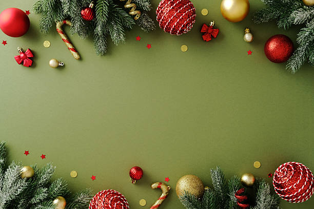 istock Christmas border with candy cane, gingerbread man, and bauble on green background 2247608187