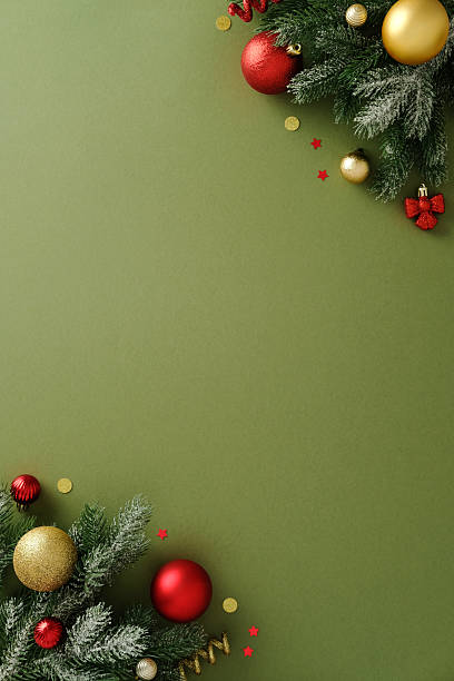 istock Diagonal Christmas border frame with red and gold baubles on olive background 2247608264