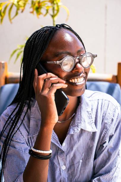 istock A young African woman using her smart phone outdoors 2247610116