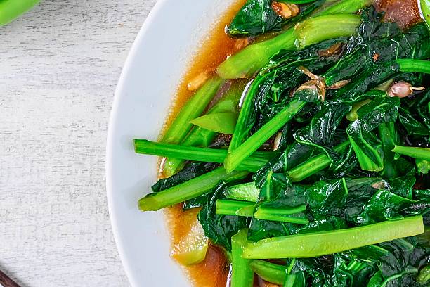 istock Savory stir fried green vegetables with garlic sauce 2247611053