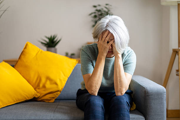 istock Senior woman feeling stressed and overwhelmed at home 2247611516