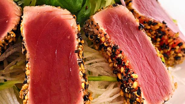 istock Seared tuna steak with sesame seed crust on noodles 2247611673