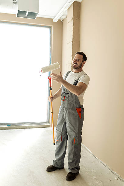 istock Mid adult wall painter working in a new renovated home 2247611986