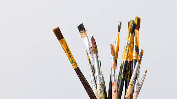 istock A collection of assorted paint brushes on a white background 2247614900