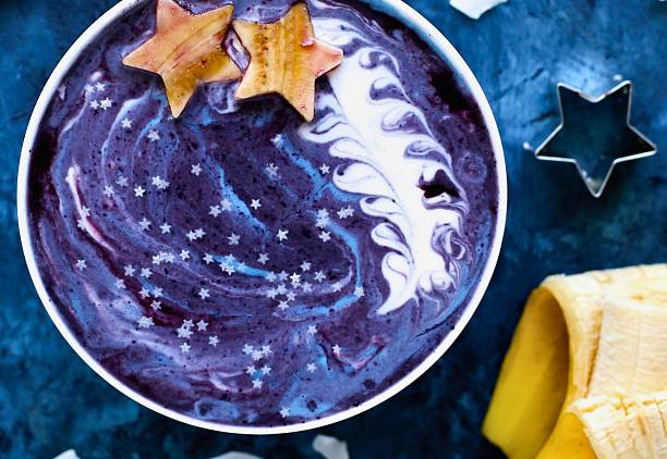 Cosmic galaxy smoothie bowl with star fruit and banana