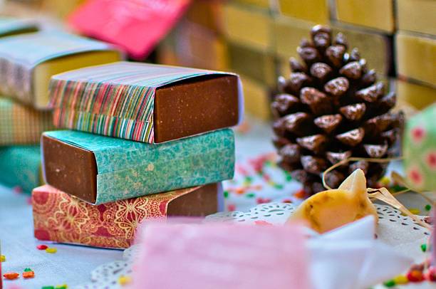 istock Festive chocolate bars wrapped in colorful paper with pinecone decoration 2247615657