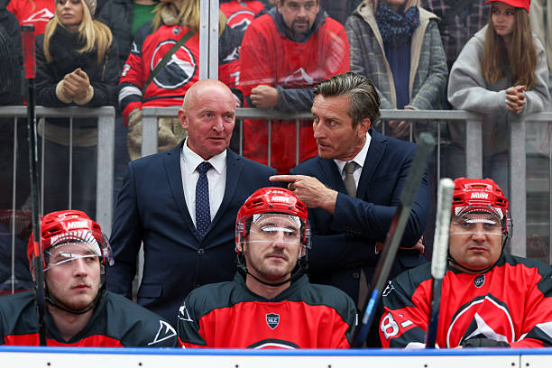 istock Ice Hockey Coaching Staff Engaged in Strategic Bench Discussion 2247615985