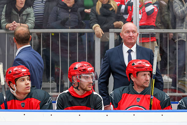 istock Ice Hockey Coaching Staff Overseeing Players on Bench During Game 2247616000