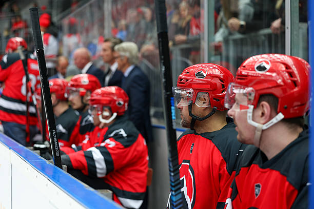 istock Ice Hockey Team Watching Game Intently From Bench 2247616012
