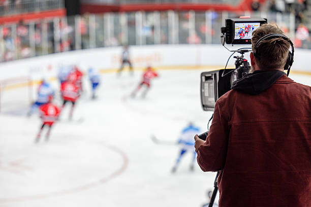 istock Camera Operator Filming Exciting Ice Hockey Match on Rink 2247616025