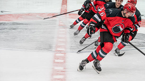 istock Ice Hockey Player Gliding with Team During Warm up 2247616065