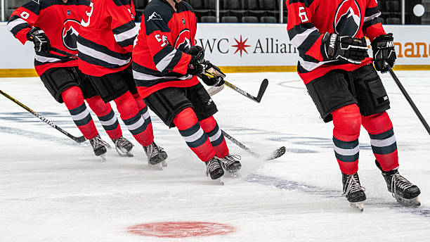 istock Hockey Players Energetically Sliding During Pre Game Warm up 2247616073