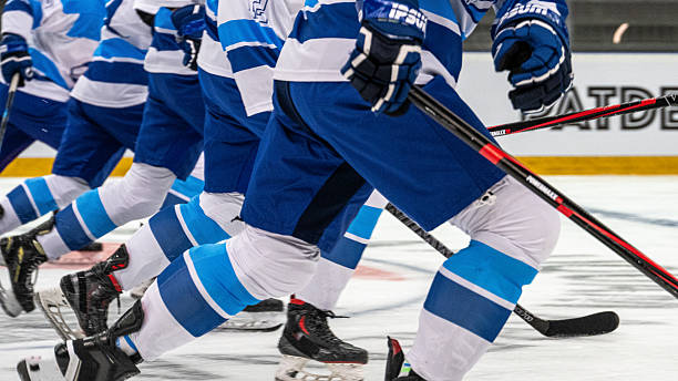 istock Hockey Player Sliding Energetically on Ice During Warm up 2247616075