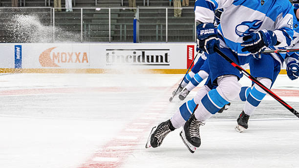 istock Ice Hockey Player Sliding Energetically on Rink Before Game 2247616088