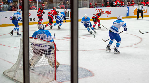 istock Dynamic Ice Hockey Match with Players in Intense Competition 2247616098