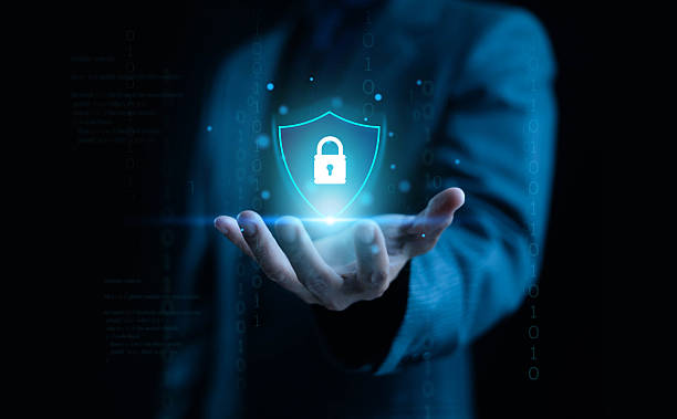 istock A futuristic cybersecurity concept showing a glowing shield with a lock icon hovering above a businessman's hand, symbolizing data protection, digital safety, encryption, and modern secure technology. 2247617900