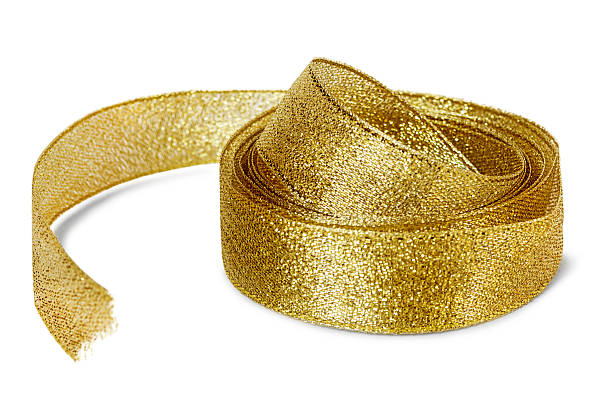 Roll of golden shiny metallic tape isolated on white background