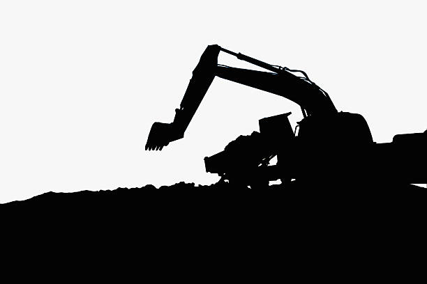 istock Excavators silhouette are digging the soil . 2247620481