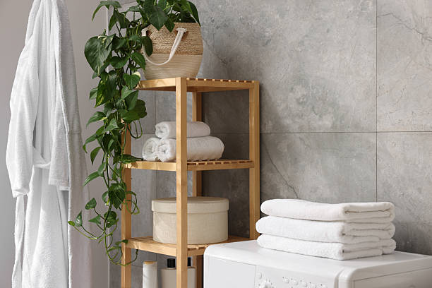 istock Soft towels, houseplant, box and shelving unit indoors 2247621542