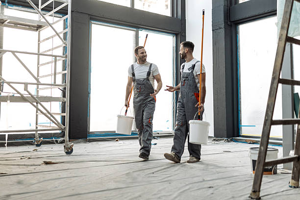 istock Wall painters walking in the empty space and looking what they need to paint 2247621990