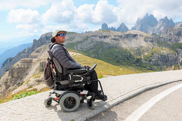 istock Man in wheelchair enjoys Dolomites view 2247623372