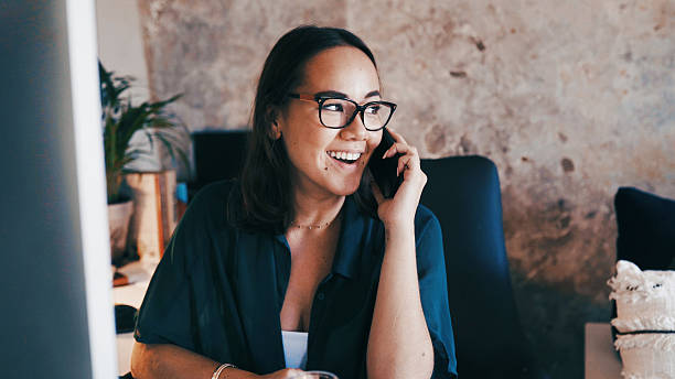 istock Happy, remote work and woman on a phone call in home for virtual assistance, admin planner and contact. Freelancer, talking and person on smartphone for chat, online consulting and conversation 2247627203