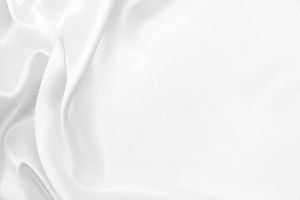 istock Smooth elegant white silk or satin luxury cloth texture as wedding background. Luxurious background design 2247629378
