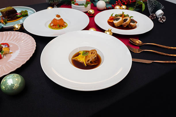 istock Elegant culinary presentation of multiple dishes on white plates 2247631175