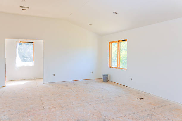 istock Empty interior space with natural light showing unfinished renovation in modern home 2247633234