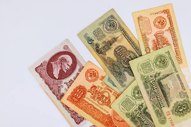 istock Vintage banknotes from USSR featuring famous leaders historical landmarks displayed on white background 2247633263