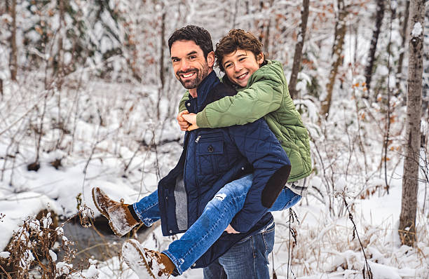 A boy and Stepfather on forest in winter season