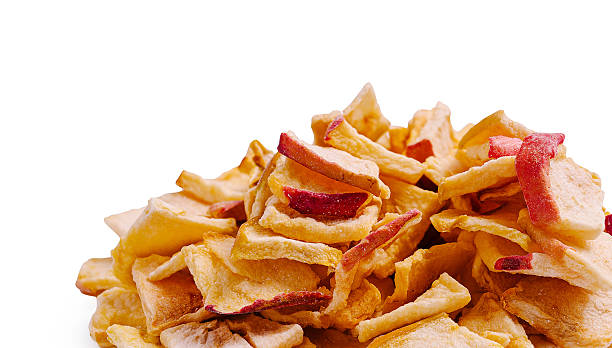 istock Crunchy apple chips scattered on a white background in a playful arrangement 2247634274