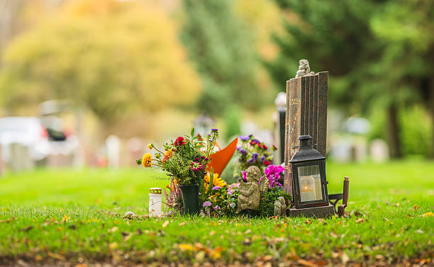 istock Colorful flowers and lantern placed on cemetery grave.. 2247635630