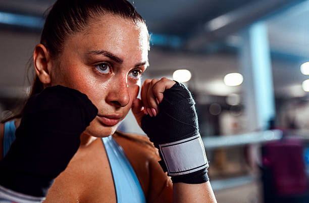 istock Confident female boxer training in boxing ring. 2247636835
