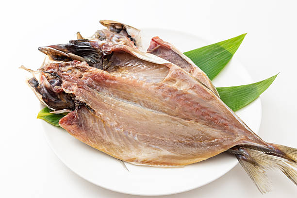 istock Dried horse mackerel on a plate on a white background 2247637044