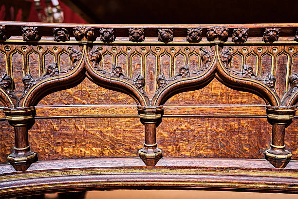 Comical carved faces on a wooden panel in St Nicholas’ Chapel in King’s Lynn, Norfolk, Eastern England.