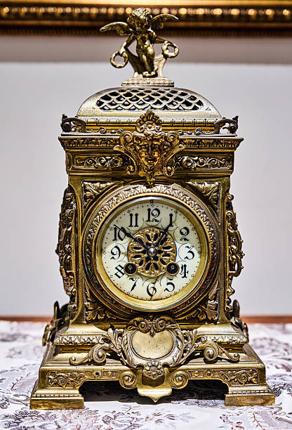 Antique clock stand on a wooden table