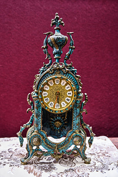 Antique clock stand on a wooden table