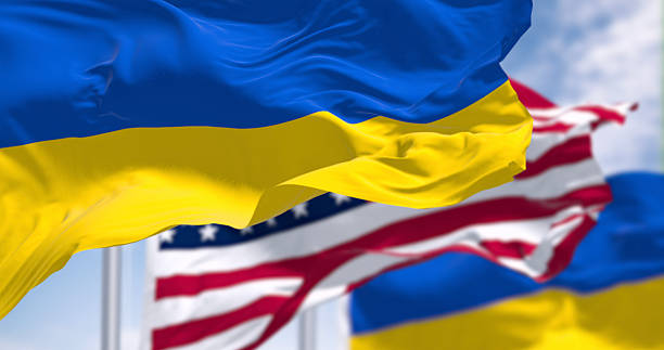 istock Ukraine and US national flags waving on a clear day 2247644685