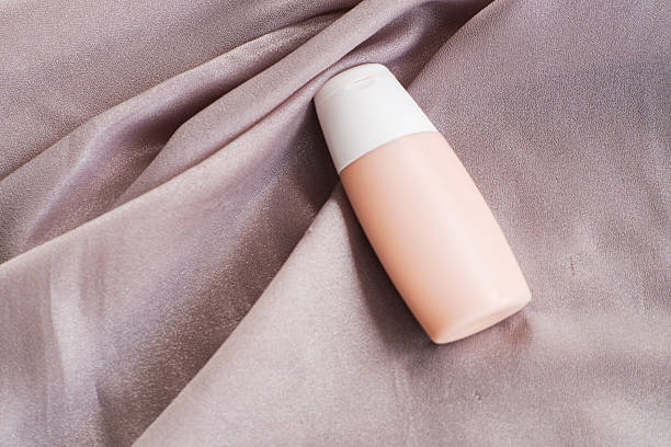 istock foundation mockup Cosmetic Scene on Soft Fabric background 2247645535