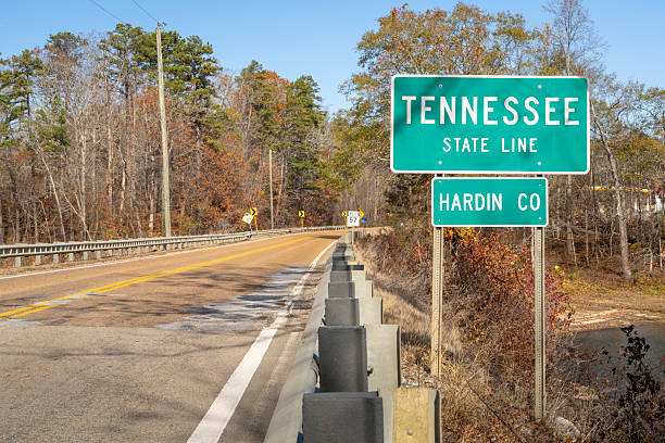 istock Tennessee road sign at state line in late fall scenery 2247647365